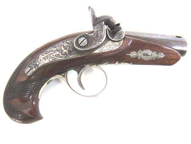 An EXCELLENT near mint condition Silver Banded and Engraved Philadelphia Pocket Derringer circa 1845 to 1871.